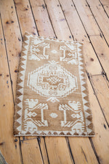 Oushak rug corner, bronze and very light rose reciprocating geometric border.