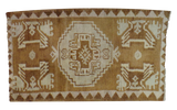 Vintage Oushak rug featuring a bronze and cream geometric medallion and border.