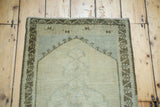 Vintage Oushak rug upper arch with silver spandrel and charcoal bronze border.