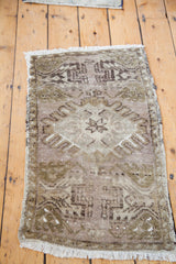 Oushak rug's geometric pattern in unique mauve, moss bronze, and white tones.