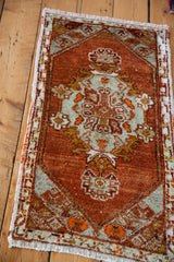 Vintage Oushak runner's hand-knotted texture, featuring happy tomato orange red and grey motifs.