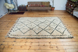 Vintage Moroccan carpet, shaggy ivory and charcoal geometric diamond and harlequin motifs.