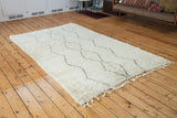 Plush ivory Beni Ourain Moroccan carpet, silver grey zig-zag and diamond motifs, fringe.