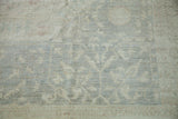 New Sivas Carpet's tone-on-tone Egyptian Mamluk pattern in soft blue, white, and terra cotta.