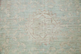 Tone-on-tone Mamluk inspired design in soft sea foam, white, and terra cotta.