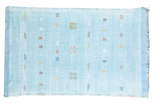 Light blue vintage woven kilim rug with scattered colorful geometric art silk motifs.