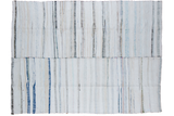 Vintage rag rug, hand woven from recycled linens with vertical ivory, charcoal, and pastel stripes.