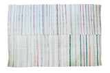 Vintage hand-woven rag rug with pastel and neutral vertical stripes, 7'3