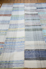 Hand-woven texture of the vintage rag rug showing unique pastel plaid effect.