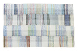 Vintage hand woven rag rug with unique plaid effect in pastel and neutral ivory and charcoal.