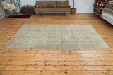 Lower corner of Vintage Kaisary carpet showing allover repeating design in ivory, beige, and subtle grey.