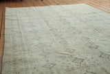 Detailed border and subtle repeating Turkish design in ivory, grey, and beige tones.