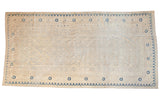 Ivory and blue vintage Khotan carpet with allover medallions, worn aesthetic, 6'8
