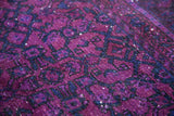 Saturated violet purple pile with deep blue geometric motifs and tone-on-tone texture.