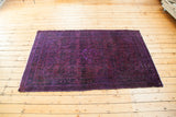 Deeply saturated vintage Persian Hamadan overdye rug, vivid violet purple with tone-on-tone patterning.