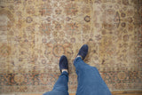 Worn aesthetic of the distressed Sparta carpet, featuring saffron gold and allover floral design.
