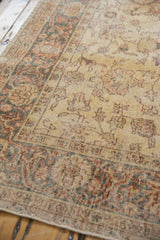Worn aesthetic and muted allover patterns on a saffron gold Sparta carpet.