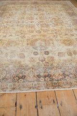 Distressed saffron gold Turkish Sparta carpet revealing worn texture and detailed floral border.
