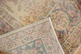 Distressed saffron yellow gold Sparta carpet pile and intricate hand-knotted foundation.