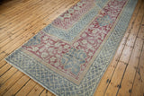 Distressed Oushak rug corner with Arts and Crafts floral motifs and geometric border.