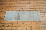 Vintage Turkish Oushak runner with distressed sea foam green and charcoal checker pattern.