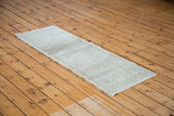 Distressed vintage Oushak runner rug with faded sea foam green and ivory checker motif.