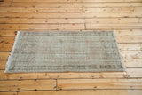 Distressed Oushak rug, faded germinating flower design in pale peach rose and ivory.