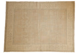Distressed Oushak carpet, soft beige gold with vintage worn aesthetic and light rose tones, 5'8