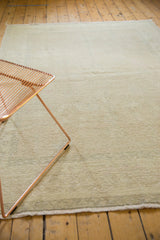 Soft beige gold texture of a distressed vintage Oushak carpet, hints of rose.