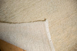 Distressed Oushak carpet's faded pale grey blue pile and tightly hand-knotted reverse.
