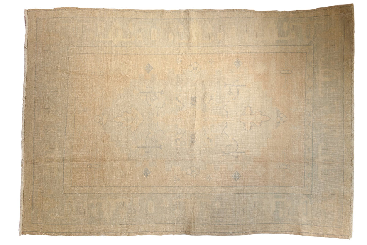Soft beige gold Vintage Oushak carpet with faded slate blue and rose patterns, 5'10" x 8'5".