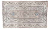 Distressed Oushak rug in blanched sand and ivory, with faded light blue patterns, 4x6.5.