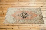 Vintage Turkish Oushak rug with faded orangey rose medallion and ivory field, 3'2