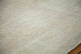Soft, worn texture and rose ivory white on a distressed Oushak rug.