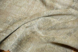 Hand-knotted foundation of a vintage Oushak rug, revealing textured beige and cream weave.
