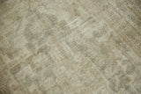 Distressed Oushak rug pile revealing pale beige, grey, and silver ivory tones.