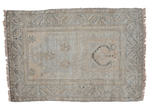 Decorative distressed Oushak rug showcasing a silver field with geometric motifs, 2'9