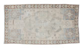 Vintage Oushak rug with faded beige, silver, blue, and bronze motifs, 3'6