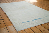 Distressed Oushak rug with prominent aqua blue abrash and faded blanched patterns.