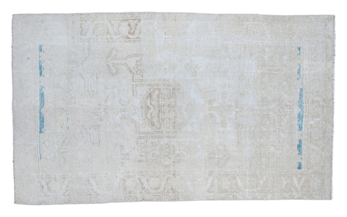 Distressed Oushak rug in blanched snow white, faded beige designs and aqua blue abrash.