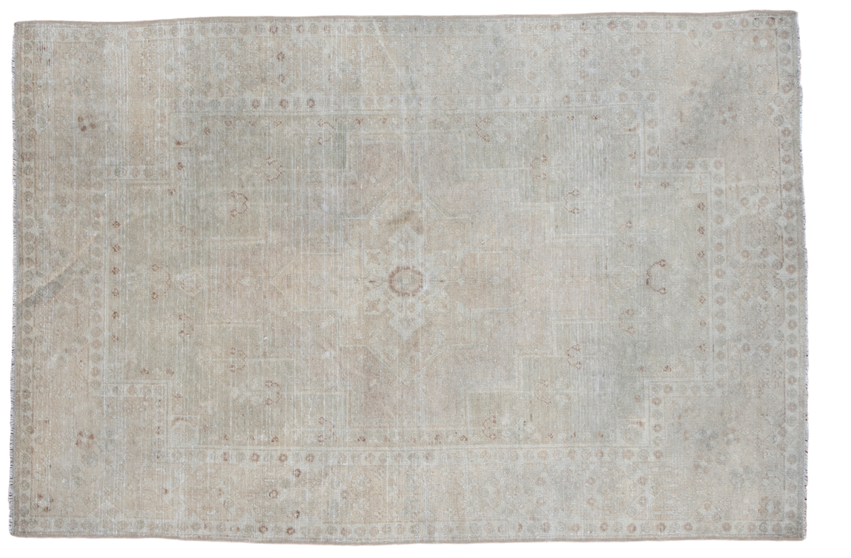 Soft faded neutral beige and ivory Vintage Oushak rug with central medallion, 4'1" x 6'2".