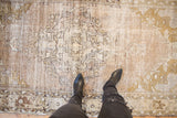 Decorative distressed texture of vintage Oushak rug in silver, beige, and bronze.