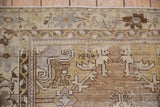Vintage distressed Oushak rug pattern in softened beige, grey, bronze, and dusty rose hues.