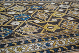 Detailed view of antique Cabistan rug's geometric palmettes, serrated leaves, charcoal, blue hues.