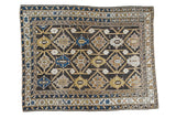 Antique Cabistan geometric rug, charcoal field with serrated motifs, blues, and earth tones. 4' x 5'1