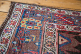 Antique Bidjar rug featuring complex gerus design motifs in sapphire, ruby, and earthen hues.