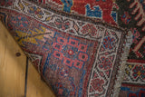 Hand-knotted antique Bidjar rug corner, showing the wool foundation and colorful pile.