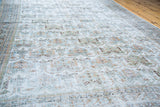 Distressed Afshar rug texture, faded light blue, green, and tan allover pattern.