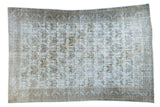Distressed vintage Afshar carpet with an allover geometric pattern on a light ivory field.