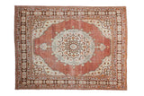 Antique Tabriz rug with classic ornate medallion, cinnabar red rust field, and pearl floral border.